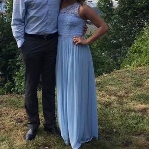 Floor length blue one shoulder dress.